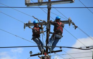 linemen repairing electric wires