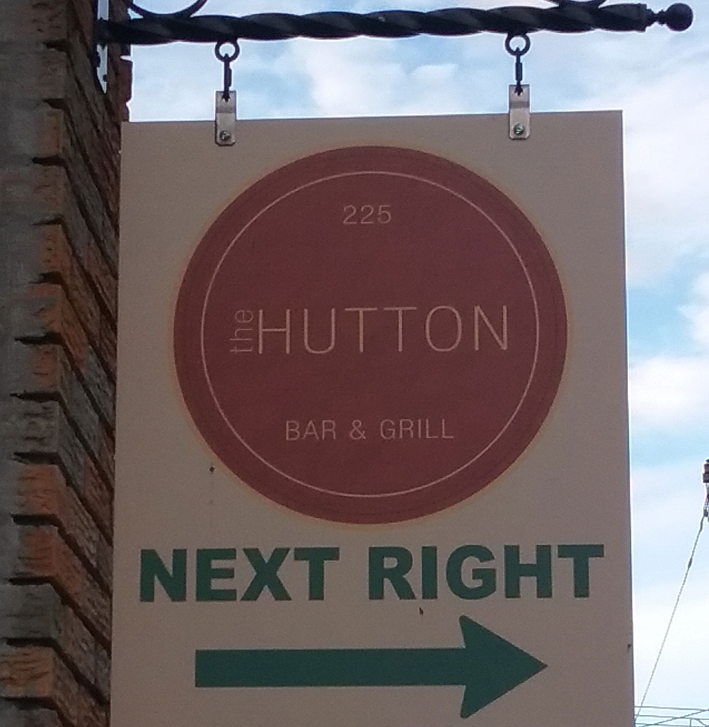 Sign for the Hutton that says "next right"