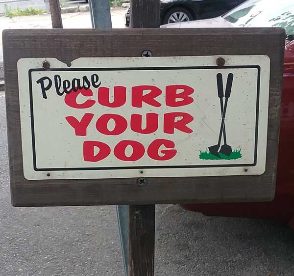Sign saying Please curb your dog