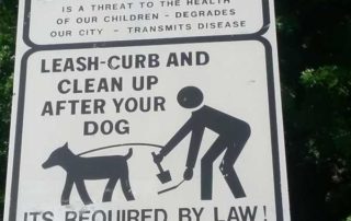 Sign DOG WASTE is a threat to the health of our children...Leash-curb and clean up after your dog, Its required by law, minimum $50.00 fine