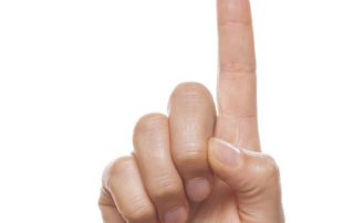 photo of hand showing one finger