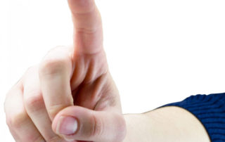 photo of a hand with one finger raised as in number 1
