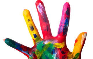 photo of a hand with colorful paint smeared all over it