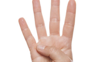 photo of a hand with four fingers raised