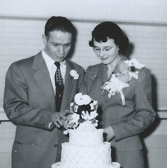 photo of my parents cutting their wedding cake