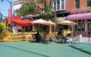 photo of a streetery, a street converted to outdoor dining space